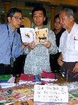Malaysian minister looks at controversial textbook